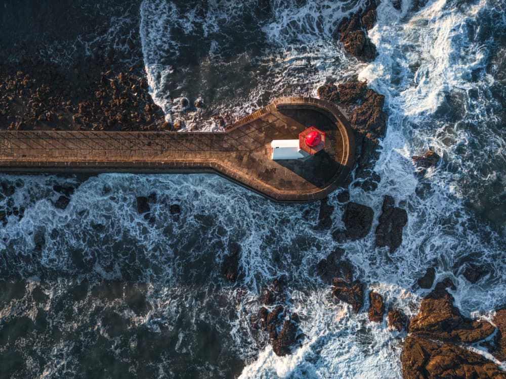 Red Lighthouse Ocean Waves by Abilio Oliveira — canvas wall art