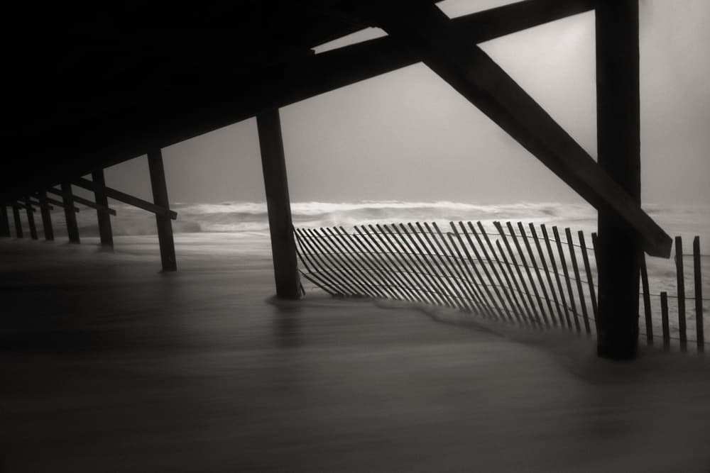 Moody Ocean Pier by Errick Cameron — canvas wall art