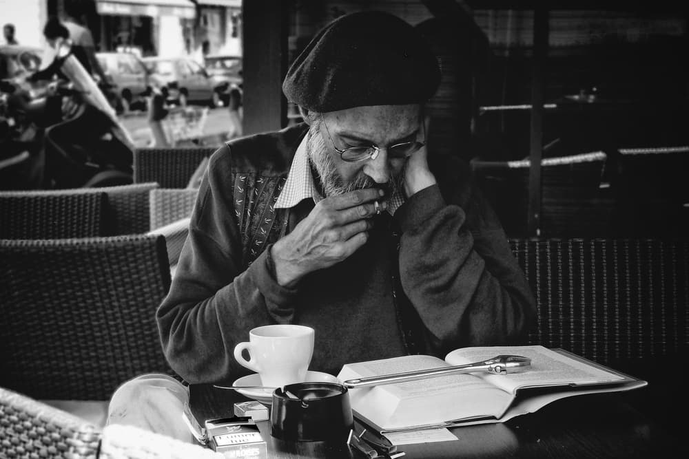 Cafe Man Reading by Abilio Silveira — canvas wall art