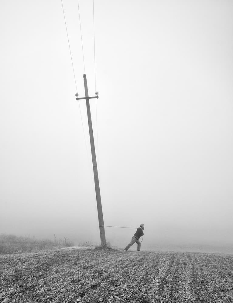 Man Pulls Power Pole by Carlo Ferrara — canvas wall art