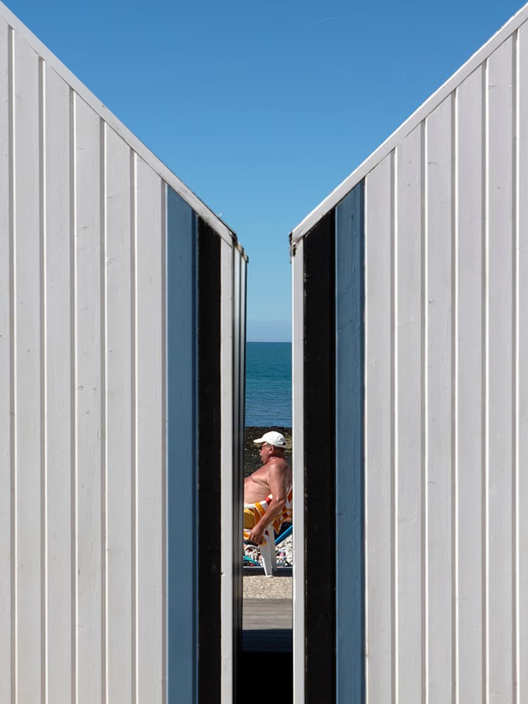Man Relaxing by the Ocean by Massimo Della Latta — canvas wall art