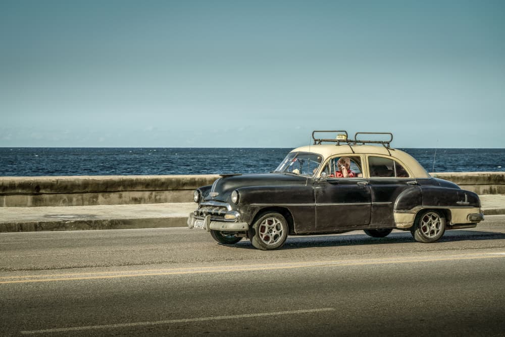 Classic Car Coastal Drive by Dieter Reichelt — canvas wall art