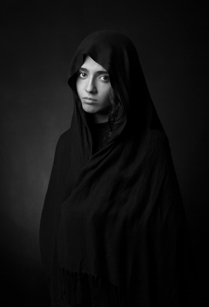 Pensive Hooded Woman by Mehdi Mokhtari — canvas wall art