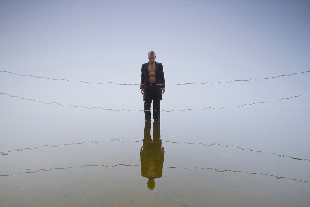 Lone Man Reflection by Leszek Paradowski — canvas wall art