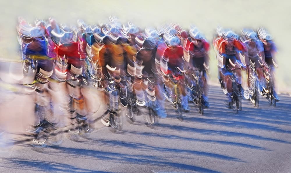 Speeding Cyclists Race by Lou Urlings — canvas wall art