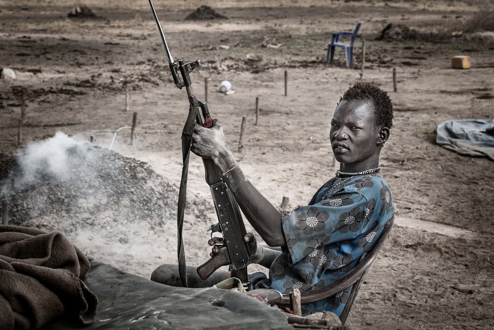 Young Man with Rifle by Joxe Inazio Kuesta Garmendia — canvas wall art