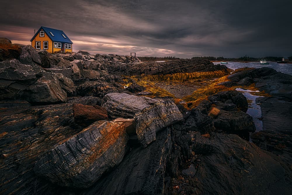 Yellow House Rocky Coast by Ben.C.L — canvas wall art