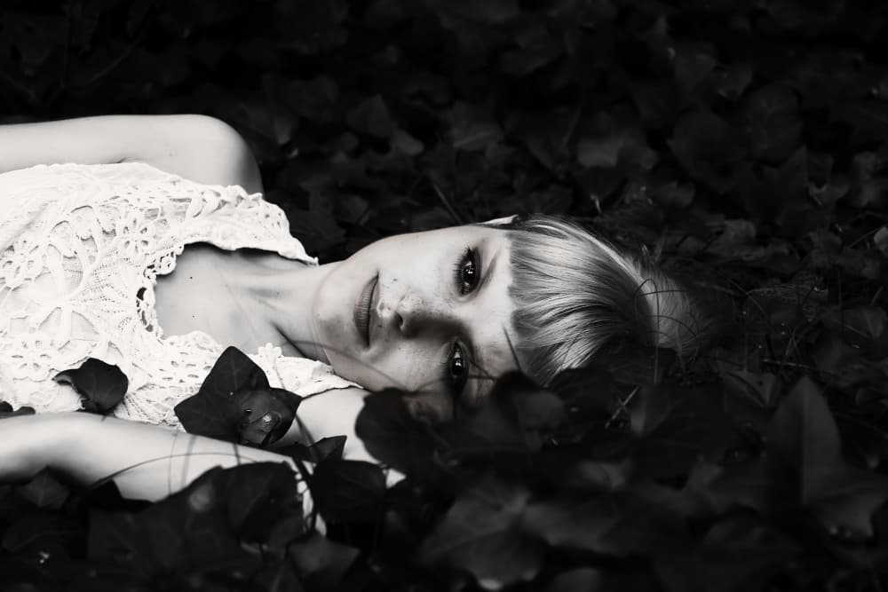 Blonde in Dark Leaves by Josefina Melo — canvas wall art