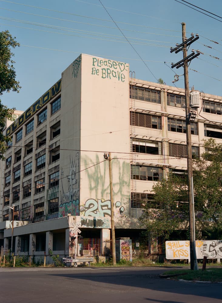 Please Be Brave Building by Bethany Young — canvas wall art