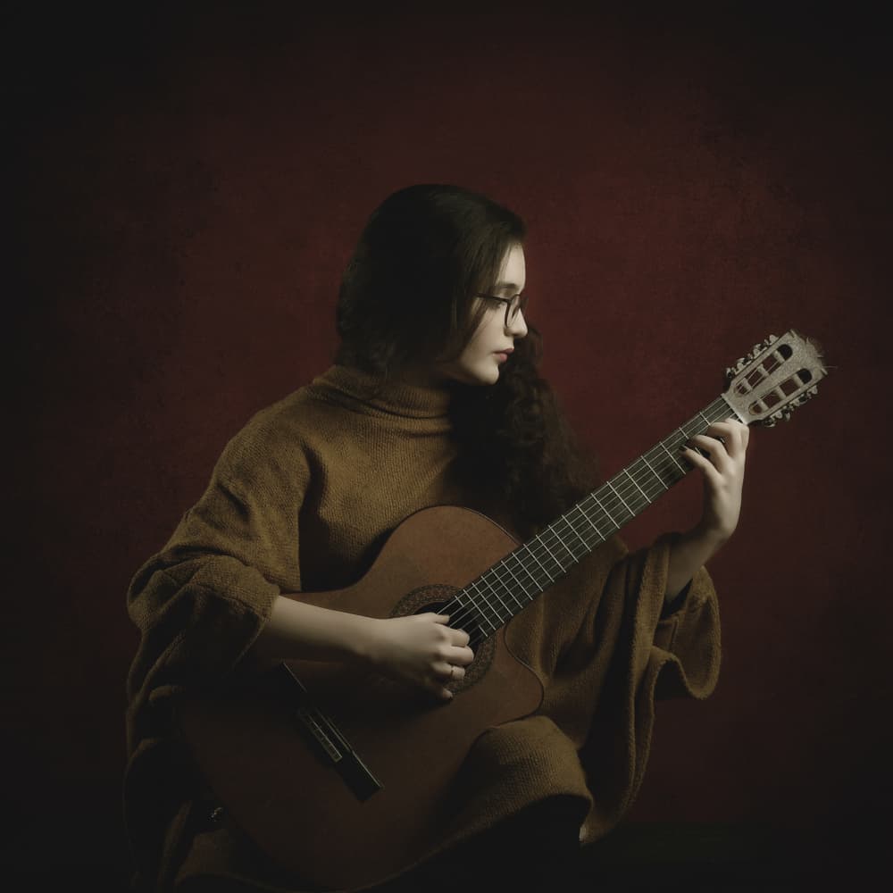 Pensive Guitar Player by Moein Hasheminasab — canvas wall art