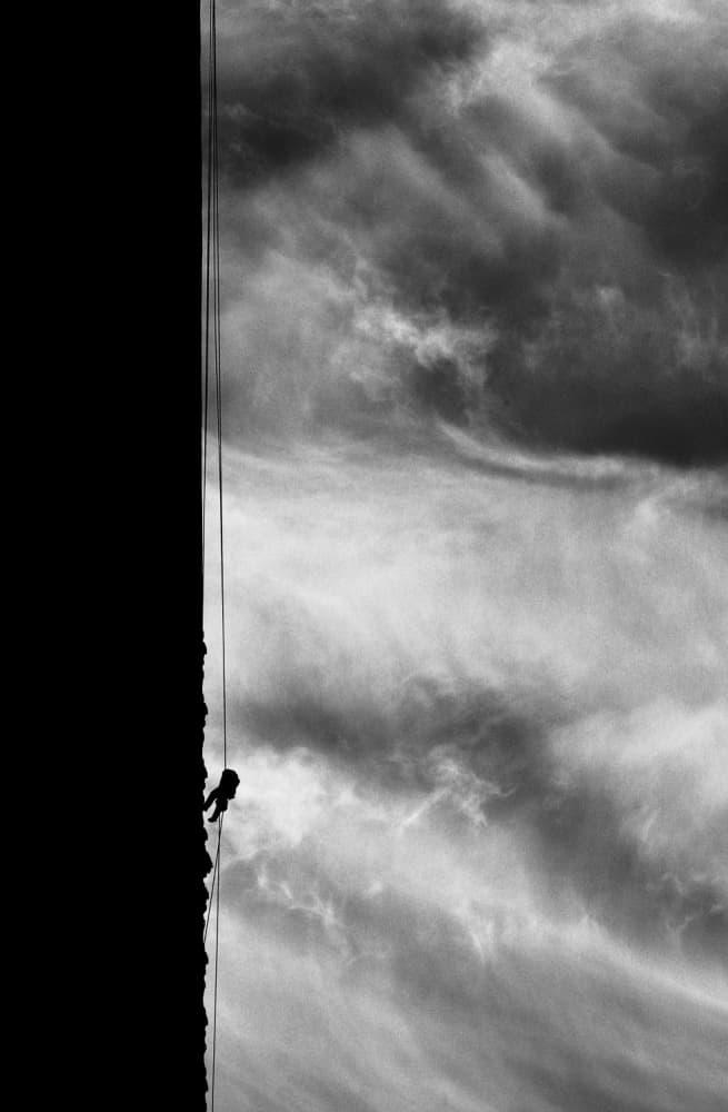 Lone Climber Dramatic Sky by Bogdan Bouşcă — canvas wall art