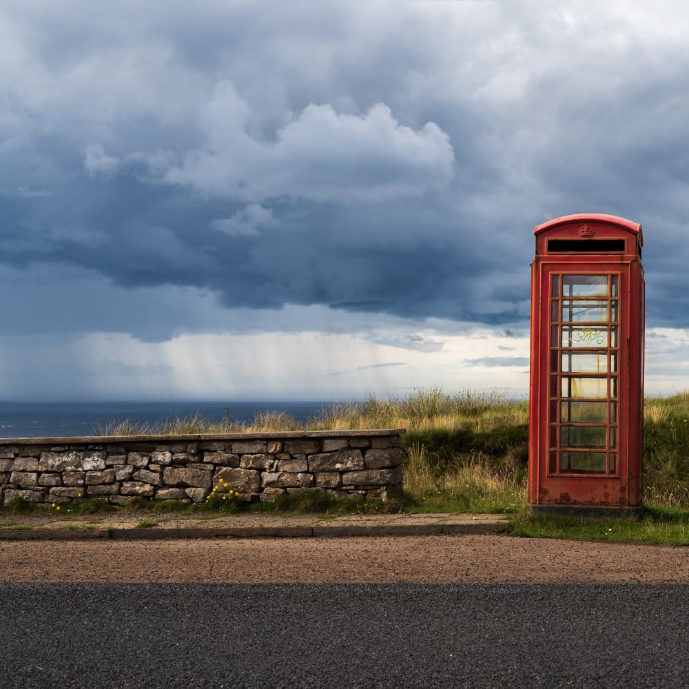 Red Booth Stormy Coast by Caroline Bomers — canvas wall art