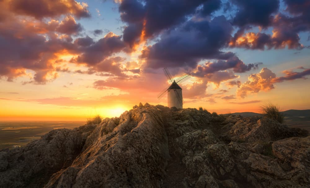 Rocky Hilltop Windmill Sunset by joanaduenas — canvas wall art