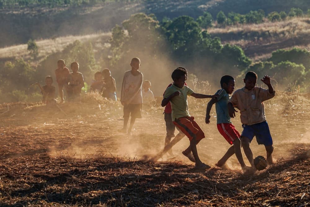 Kids Playing Soccer by Mei Shi — canvas wall art