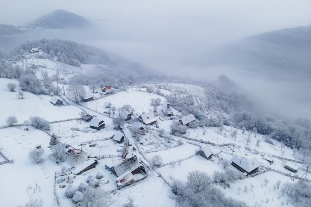Snowy Mountain Village by Ovidiu Satmari — canvas wall art