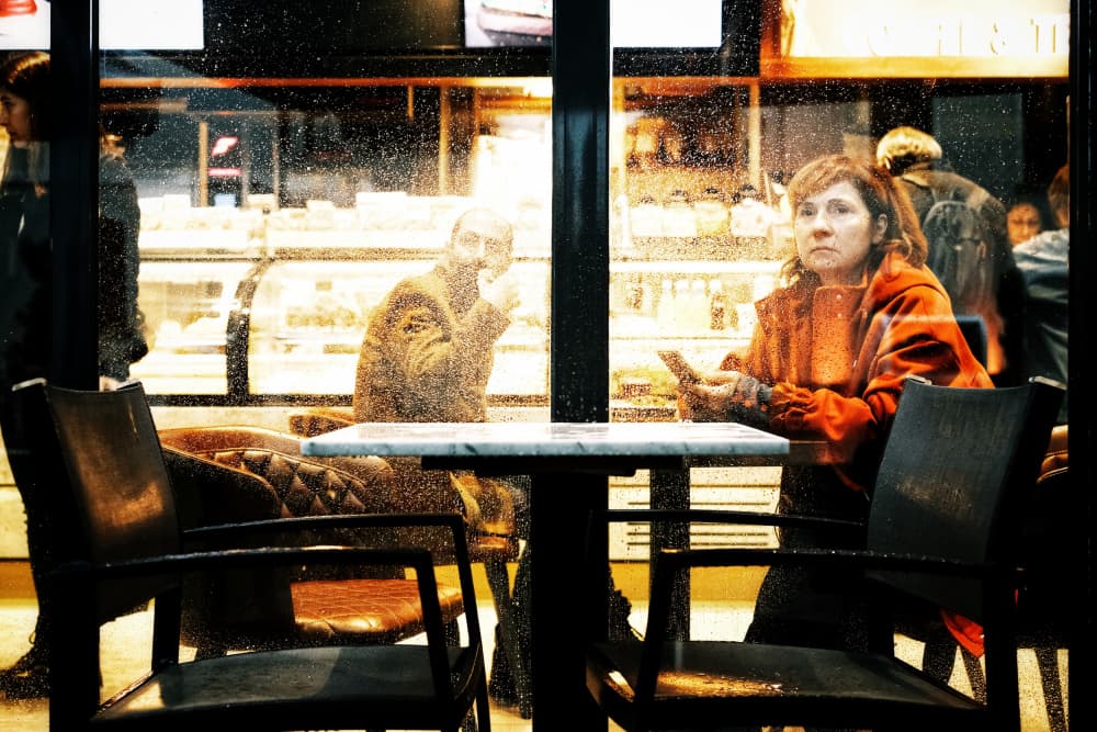 Café Window Reflection by Ali Ayer — canvas wall art