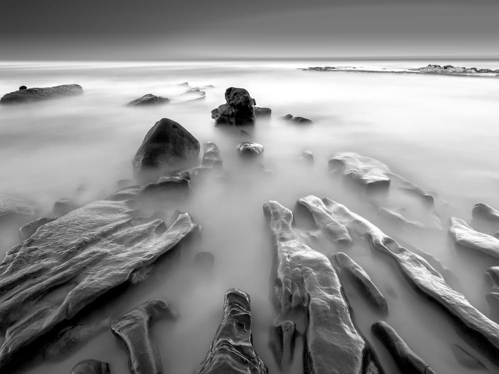 Misty Ocean Rocks by Yi Fan — canvas wall art