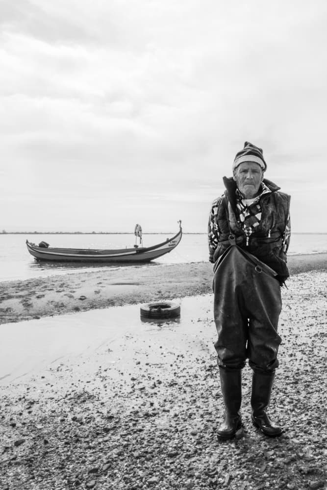 Old Fisherman By Boat by Filipe P Neto — canvas wall art