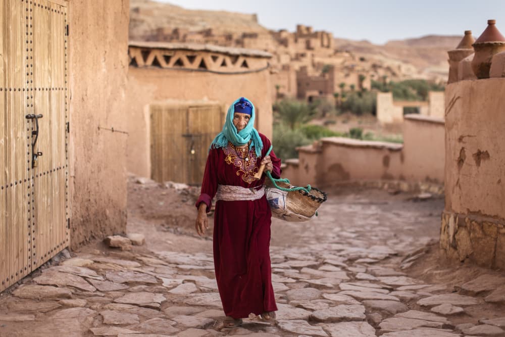 Moroccan Woman Red Dress by Dan Mirica — canvas wall art