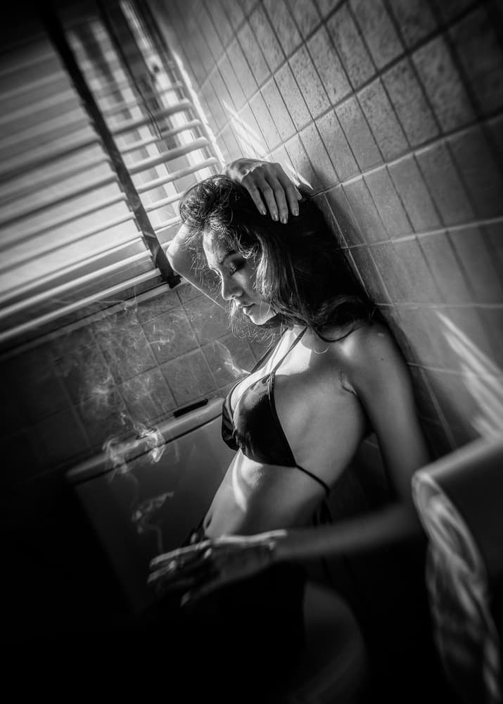 Woman Smoking in Light by ADIREK M — canvas wall art