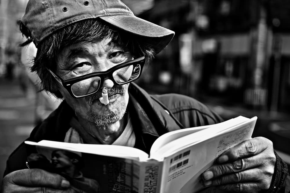 Candid Man Reading City by Shinji Isobe — canvas wall art