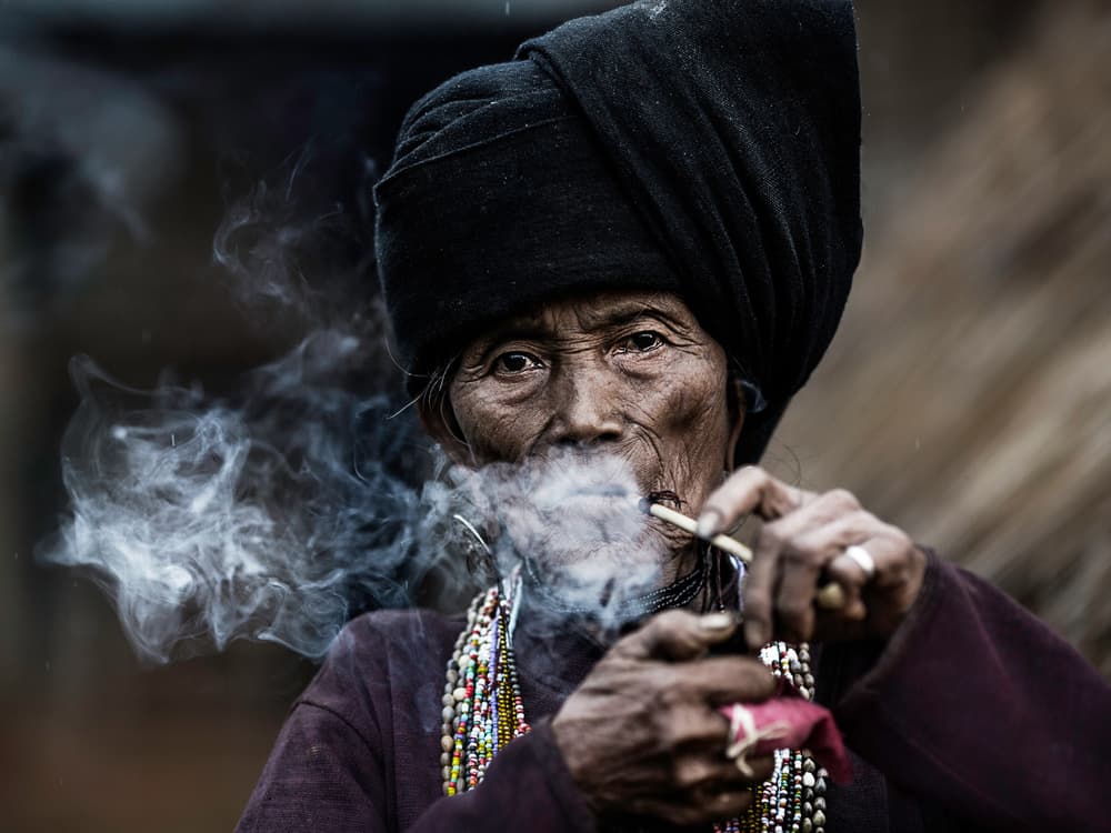 Tribal Woman Smoking Pipe by Amnon Eichelberg — canvas wall art