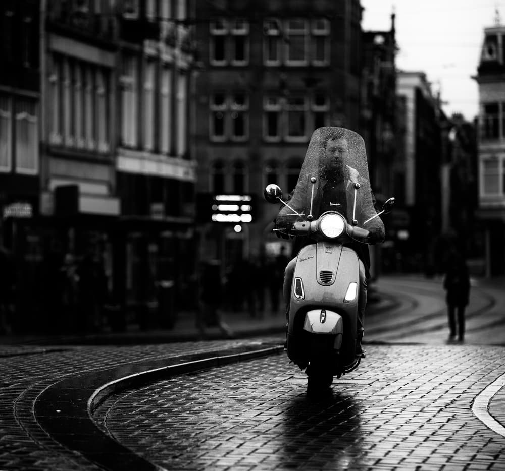 Rainy City Scooter by Julien Oncete — canvas wall art
