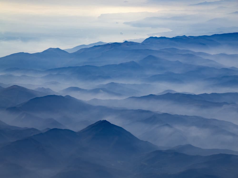 Misty Blue Mountains by Andrea Izzotti — canvas wall art