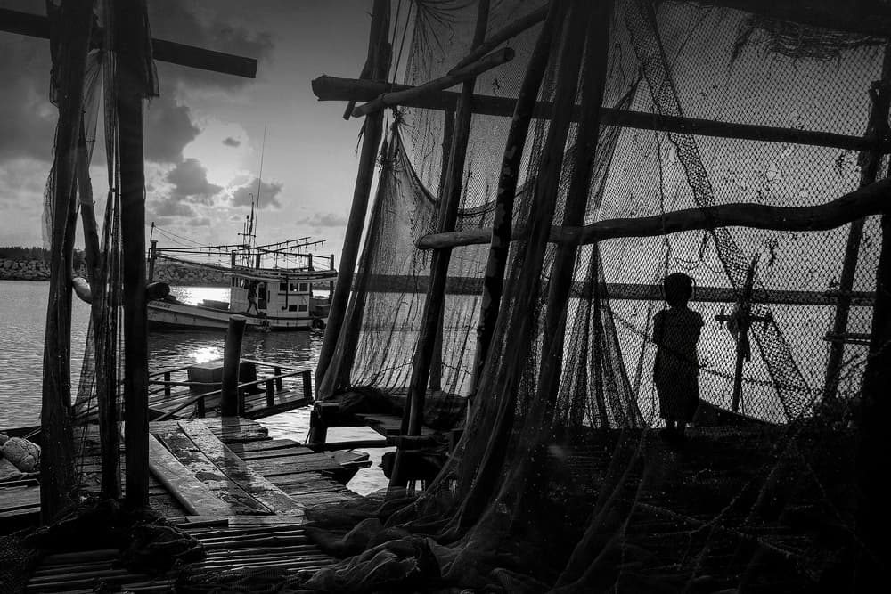 Child and Fishing Boats by Ekkachai Khemkum — canvas wall art