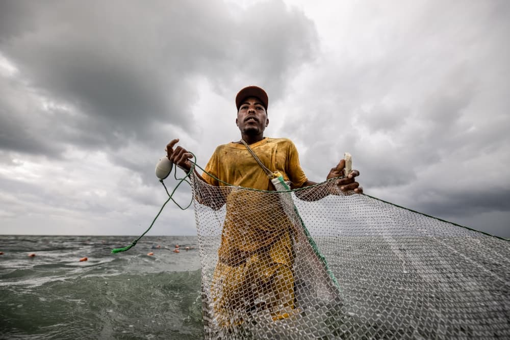 Fisherman Under Storm Clouds by Adrian — canvas wall art
