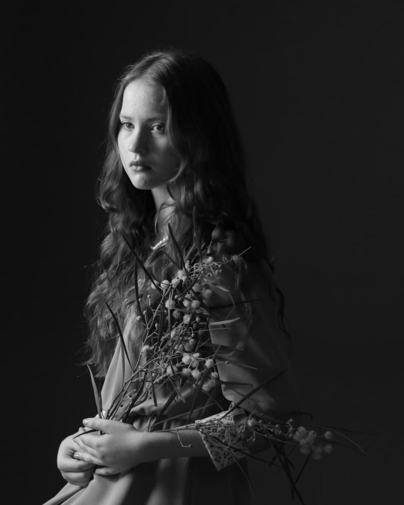 Pensive Girl with Branches by Anna Kogan — canvas wall art