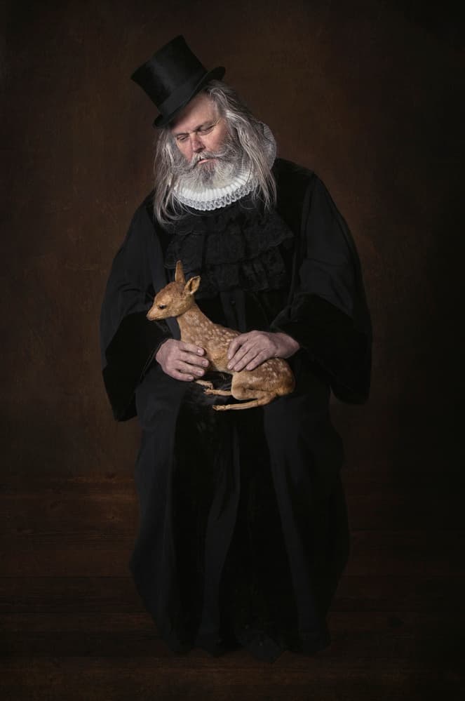 Gentle Man Holding Fawn by Carola Kayen-Mouthaan — canvas wall art