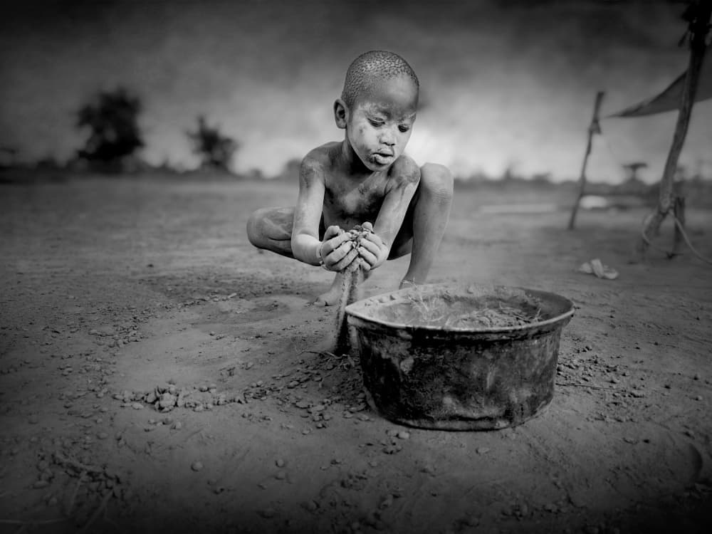 Young Boy Sifting Dirt by Svetlin Yosifov — canvas wall art