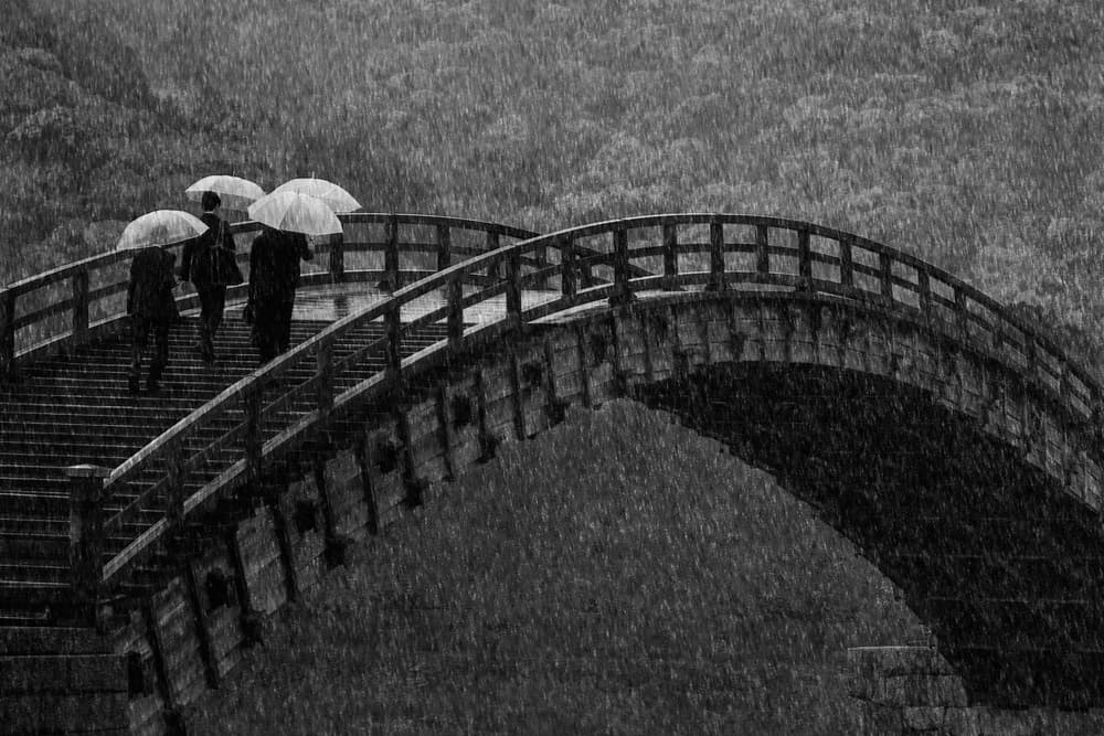 Rainy Bridge Walk by Ekkachai Khemkum — canvas wall art
