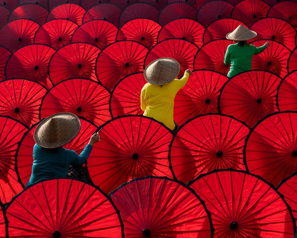 People With Red Umbrellas by Fira Mikael — canvas wall art