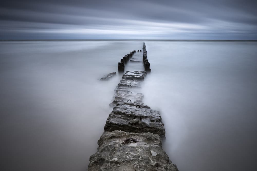 Serene Ocean Groyne by Łukasz Małkiewicz — canvas wall art