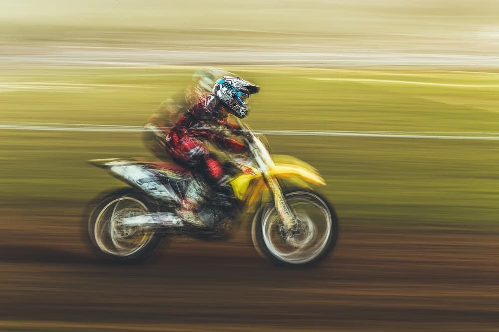 Motocross Speed Blur by Carlos Gonzalez — canvas wall art