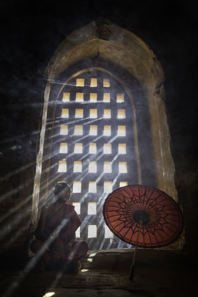 Monk in Temple Light by Amnon Eichelberg — canvas wall art
