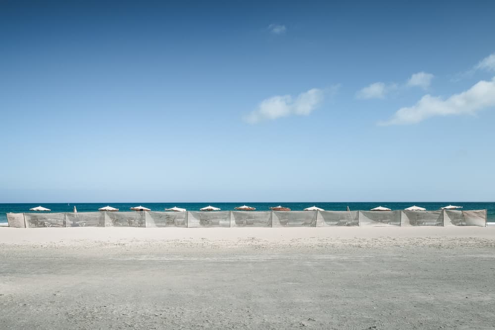 Tranquil Beach Umbrellas by Renate Wasinger — canvas wall art