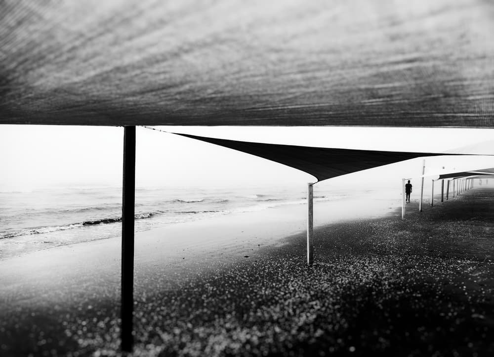 Solitary Beach Stroll by Marius Surleac — canvas wall art