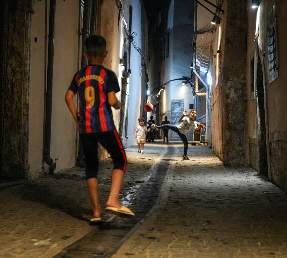 Street Football Game by Bashar Alsofey — canvas wall art