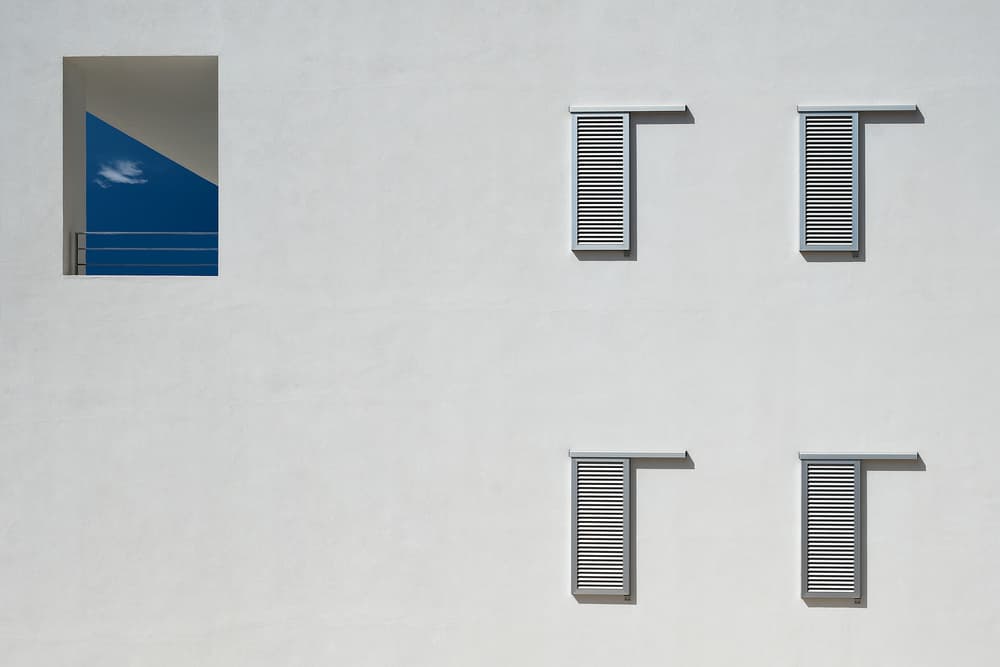 White Wall Blue Sky by Rolf Endermann — canvas wall art