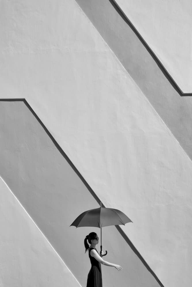 Woman with Umbrella by Kieron Long — canvas wall art