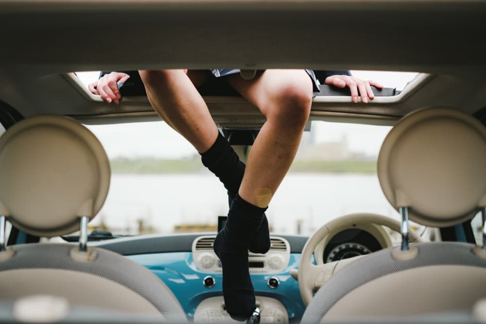 Legs In Sunroof by HIDASAN — canvas wall art