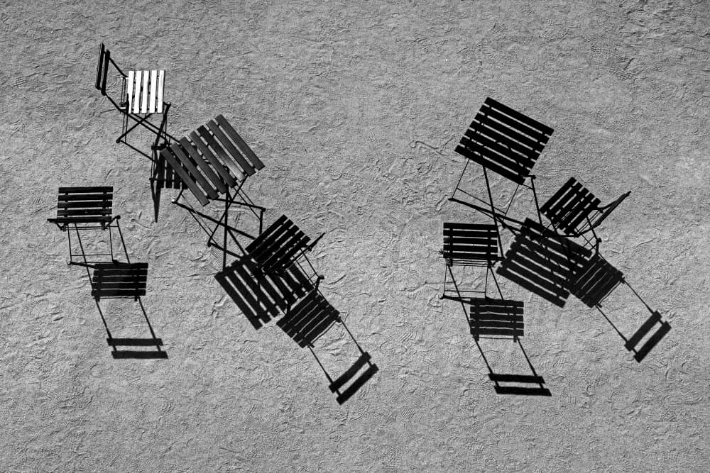 Sunlit Chairs and Shadows by Holger Goehler — canvas wall art