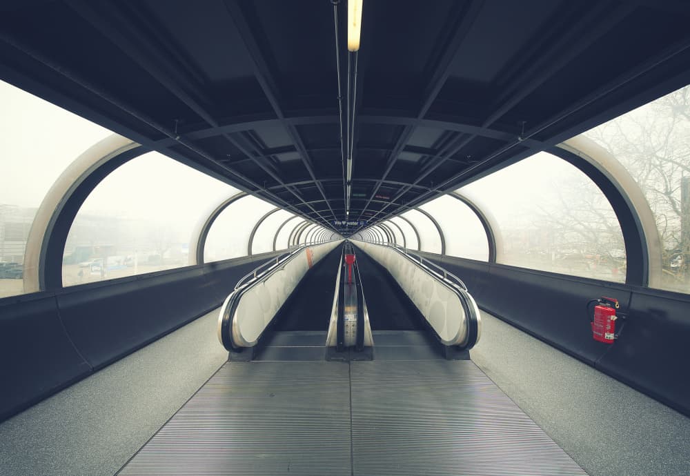 Futuristic Escalator Tunnel by Erhard Batzdorf — canvas wall art