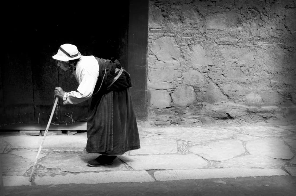 Woman With Walking Cane by Saskia Dingemans — canvas wall art