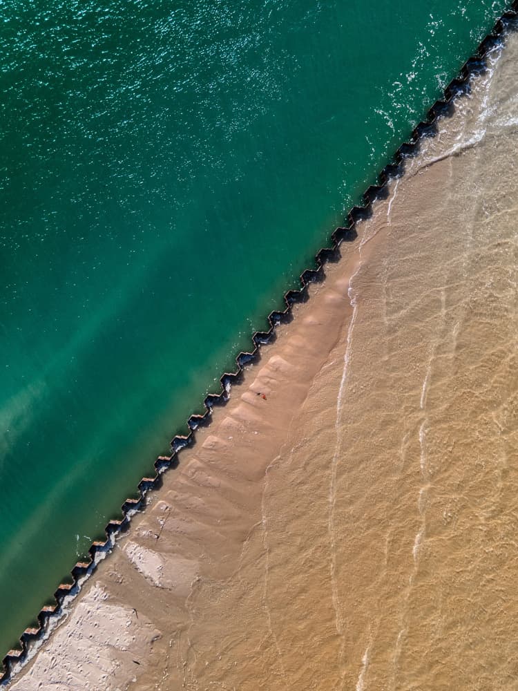 Green Water Meets Sand by Anna Kirchner — canvas wall art