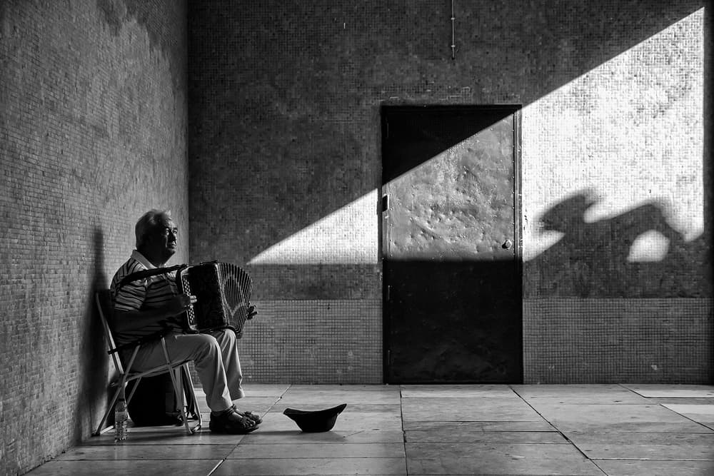 Solitary Street Musician by Luis Sarmento — canvas wall art