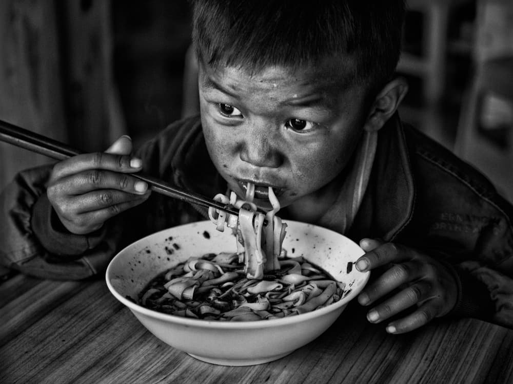 Boy's Warm Noodle Meal by BJ Yang — canvas wall art